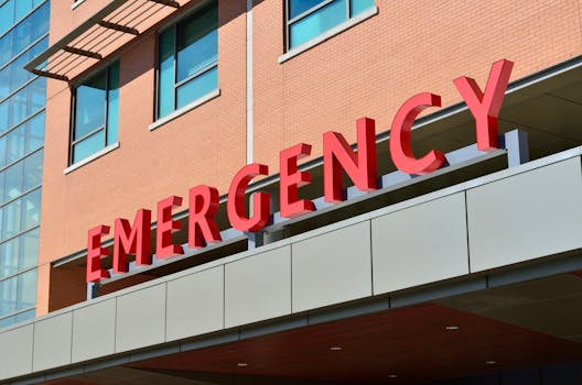 pexels photo 263402 263402 Close-up of a modern hospital emergency room entrance with prominent red letters.